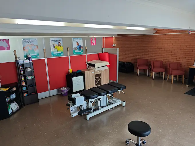 Another view of Angel Chiropractic Brisbane treatment area showing modern chiropractic tables, clean layout, and bright, welcoming environment