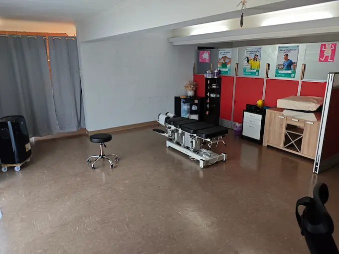 Chiropractic treatment area at Angel Chiropractic Brisbane with treatment tables, modern equipment, and bright, clean environment
